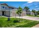 Row of townhouse-style homes featuring garages, green lawns and modern design at 5242 Columbine Ln, Denver, CO 80221