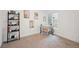 Minimalist office features a desk, shelving, and a large window for natural light at 5242 Columbine Ln, Denver, CO 80221