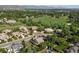 An aerial shot of a serene suburban neighborhood featuring well-maintained homes with manicured lawns and mature trees at 3380 Quail Ct, Wheat Ridge, CO 80033