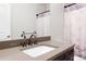 Bathroom with gray countertop, vanity, decorative faucet, and shower with patterned curtain at 3380 Quail Ct, Wheat Ridge, CO 80033