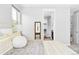 This bedroom features a view to ensuite bathroom and closet at 3380 Quail Ct, Wheat Ridge, CO 80033