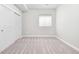 Neutral carpeted bedroom with double door closet and window with blinds providing natural light at 3380 Quail Ct, Wheat Ridge, CO 80033