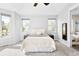 A bright bedroom featuring many windows, neutral colors and a vaulted ceiling at 3380 Quail Ct, Wheat Ridge, CO 80033