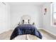 Cozy bedroom with hardwood floors, a comfortable bed, and plenty of natural light at 3380 Quail Ct, Wheat Ridge, CO 80033