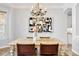 Dining room with a chandelier, stylish decor, and a view to the kitchen at 3380 Quail Ct, Wheat Ridge, CO 80033