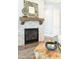 Close up of a cozy fireplace with a decorative mantel and tile surround at 3380 Quail Ct, Wheat Ridge, CO 80033
