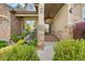 Inviting front porch with stone accents, decorative lighting, and space for seating at 3380 Quail Ct, Wheat Ridge, CO 80033