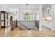 Hallway with hardwood floors, crown molding, and natural light at 3380 Quail Ct, Wheat Ridge, CO 80033