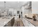 Elegant kitchen featuring stainless steel appliances, granite countertops, and an island sink at 3380 Quail Ct, Wheat Ridge, CO 80033