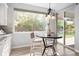 Bright kitchen nook with large windows and sliding doors, offering views of the yard at 3380 Quail Ct, Wheat Ridge, CO 80033