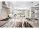 Bright, modern kitchen with stainless steel appliances, a gas stove, and a view of the backyard at 3380 Quail Ct, Wheat Ridge, CO 80033