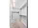 Walk-in closet featuring carpeted floor, white walls, and ample shelf space at 3380 Quail Ct, Wheat Ridge, CO 80033
