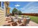 Relaxing backyard patio area with comfortable seating, perfect for outdoor entertaining at 5338 Potentilla St, Brighton, CO 80601