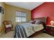 Comfortable bedroom with a large bed, rocking chair, and natural light at 5338 Potentilla St, Brighton, CO 80601
