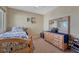 Cozy bedroom featuring light wood furnishings and carpet at 5338 Potentilla St, Brighton, CO 80601