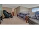 Relaxing bonus room with comfortable seating and lots of natural light at 5338 Potentilla St, Brighton, CO 80601
