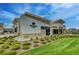 Modern building with attractive landscaping, stone accents, and expansive windows at 5338 Potentilla St, Brighton, CO 80601