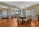 Inviting dining room with hardwood floors, neutral decor, and an open layout at 5338 Potentilla St, Brighton, CO 80601