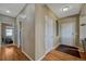 Entryway featuring wood floors and access to bedrooms at 5338 Potentilla St, Brighton, CO 80601