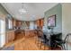 Spacious kitchen with wood cabinets, stainless steel appliances, an island, and bar seating at 5338 Potentilla St, Brighton, CO 80601