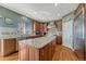 Well-equipped kitchen with a granite island, stainless steel appliances, and ample cabinet space at 5338 Potentilla St, Brighton, CO 80601