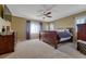 Spacious main bedroom with a ceiling fan and large windows at 5338 Potentilla St, Brighton, CO 80601