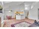 Open-concept kitchen and living area with tile flooring and natural light at 12483 E Wesley Ave, Aurora, CO 80014