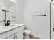 Clean bathroom with white vanity, shower, and toilet at 8773 Yellowcress St, Littleton, CO 80125