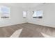 Bright bedroom with neutral walls, carpet, and multiple windows at 8773 Yellowcress St, Littleton, CO 80125