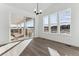 Bright dining area with hardwood floors and sliding glass doors leading to deck at 8773 Yellowcress St, Littleton, CO 80125