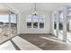 Sunlit dining room featuring hardwood floors and deck access at 8773 Yellowcress St, Littleton, CO 80125