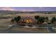 Idyllic property on sprawling acreage, secured by a white perimeter fence and a private circular drive at 5540 Horseshoe Trl, Sedalia, CO 80135