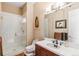 Bathroom featuring a glass-enclosed shower, white tile, and modern fixtures at 5540 Horseshoe Trl, Sedalia, CO 80135