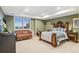 Inviting bedroom with large window, comfortable mattress, a cozy loveseat, and decorative lamps and wall art at 5540 Horseshoe Trl, Sedalia, CO 80135