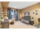 Cozy Bedroom with a crib, dark blue curtains, and decorative space-themed artwork at 5540 Horseshoe Trl, Sedalia, CO 80135