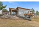 Contemporary home with a well-maintained backyard, patio, and landscaped surroundings at 5540 Horseshoe Trl, Sedalia, CO 80135