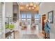 Spacious foyer with high ceilings, a chandelier, tile floors, and views into the open living spaces at 5540 Horseshoe Trl, Sedalia, CO 80135