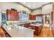 Well-appointed kitchen featuring stainless steel appliances, custom wood cabinetry, and granite countertops at 5540 Horseshoe Trl, Sedalia, CO 80135