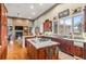 Well-lit kitchen featuring granite counters, custom wood cabinetry, and an expansive island at 5540 Horseshoe Trl, Sedalia, CO 80135