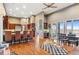 Open kitchen and dining area with bar seating, stainless steel appliances, and natural light at 5540 Horseshoe Trl, Sedalia, CO 80135