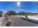 Large backyard with fire pit and gravel landscaping at 42396 Glen Abbey Dr, Elizabeth, CO 80107