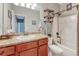 Main bathroom with tub, shower, and updated vanity at 42396 Glen Abbey Dr, Elizabeth, CO 80107