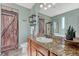 Bathroom with granite countertop, large mirror, and a walk-in shower at 42396 Glen Abbey Dr, Elizabeth, CO 80107