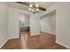 Dining room showcasing hardwood floors, beam ceiling, and opening looking into the kitchen at 42396 Glen Abbey Dr, Elizabeth, CO 80107