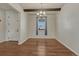 Well-lit dining room featuring hardwood flooring, a beam ceiling, and a contemporary chandelier at 42396 Glen Abbey Dr, Elizabeth, CO 80107