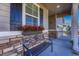 Inviting front porch with a bench and window box planters at 42396 Glen Abbey Dr, Elizabeth, CO 80107