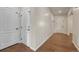 Hallway with beautiful flooring and neutral paint featuring several doors and entry to the home at 42396 Glen Abbey Dr, Elizabeth, CO 80107