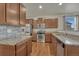 Well-lit kitchen featuring stainless steel appliances and granite countertops at 42396 Glen Abbey Dr, Elizabeth, CO 80107