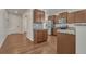 Modern kitchen with stainless steel appliances, stone backsplash, and granite counters at 42396 Glen Abbey Dr, Elizabeth, CO 80107