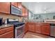 Modern kitchen with granite countertops, stainless steel appliances, and ample cabinetry at 42396 Glen Abbey Dr, Elizabeth, CO 80107